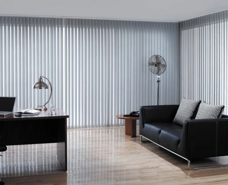 Grey vertical blinds for professional Dubai office windows.