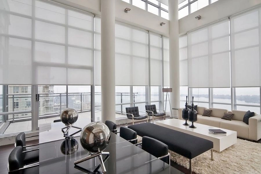 Luxury white sheer roller blinds for Dubai penthouses.