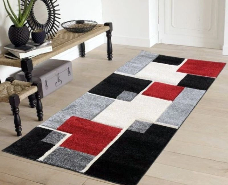 Modern geometric pattern floor mat with red and black.