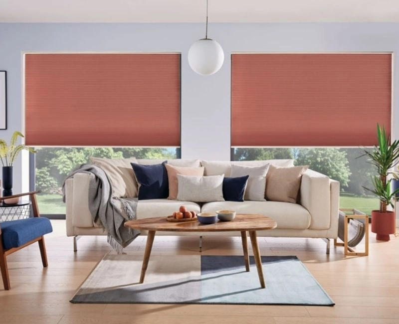 Modern terracotta roller blinds in Dubai living room.